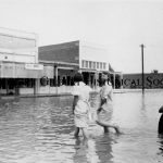 19 - Women Wading in flood water 1930s